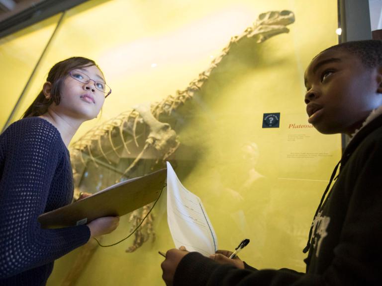 Two young students in a museum