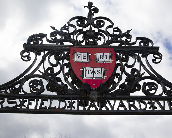 An iron gate with the Harvard shield in it