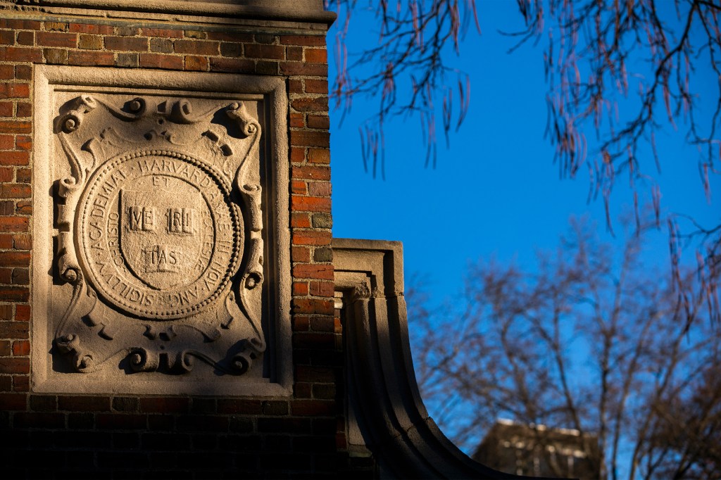 A gate with the Harvard shield