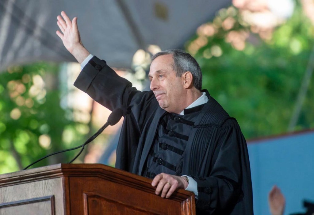 President Bacow waving to the crowd.