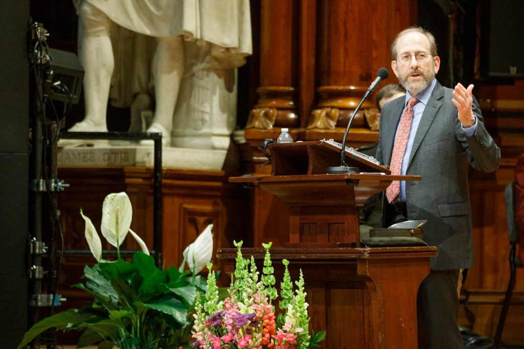Alan Garber talking at a podium during the ROTC ceremony