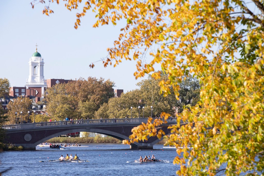 A bridge going over the Charles river with Harvard campus nearby
