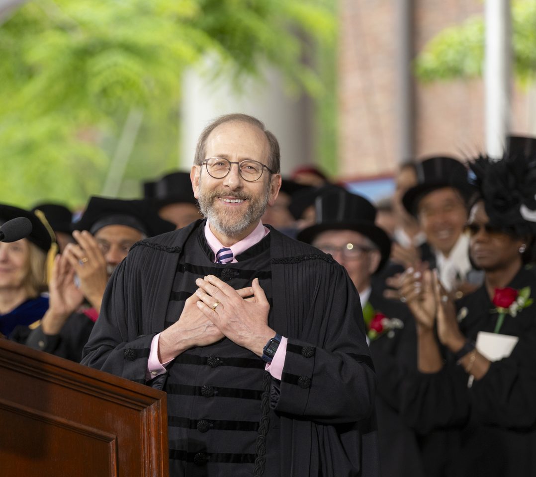 President Garber covers his hands over his heart.
