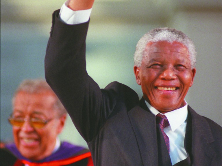 Nelson Mandela waving to the crowd at commencement