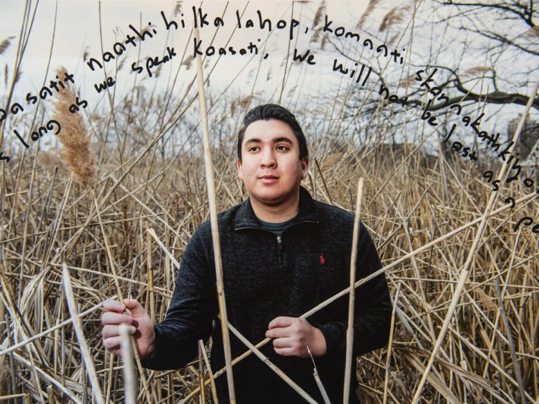 Eli Langley in a field of tall grass