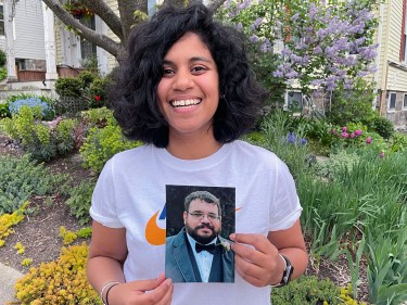 Elena Milius holding a photo of her brother