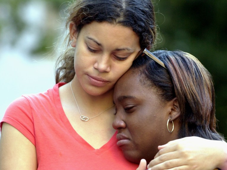 two students consoling each other