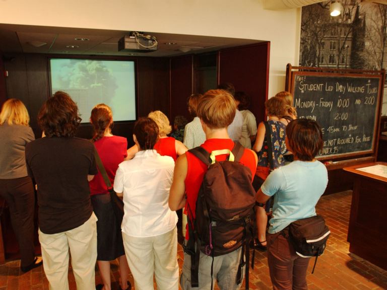 Students gathered around a television