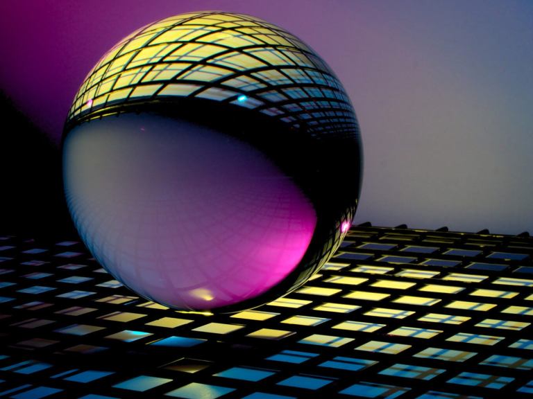 A glass orb on a glowing grid. Very evocative of future stuff.