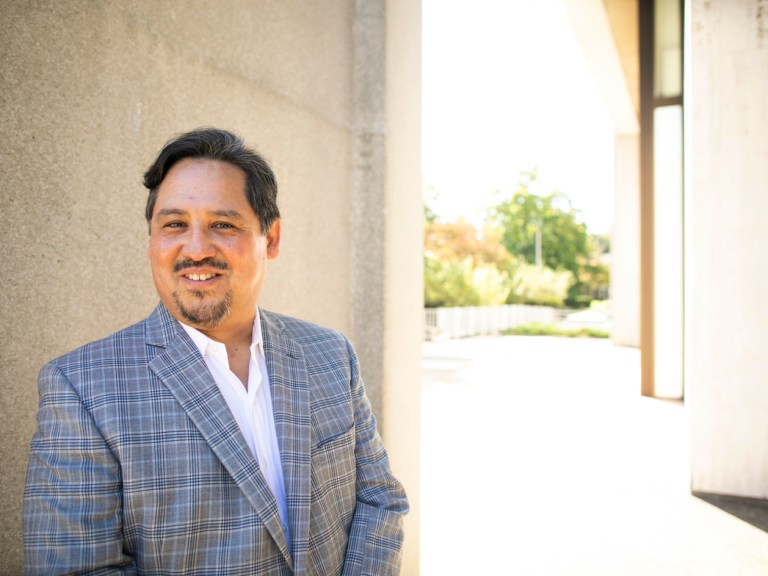 Joseph Gone standing outside