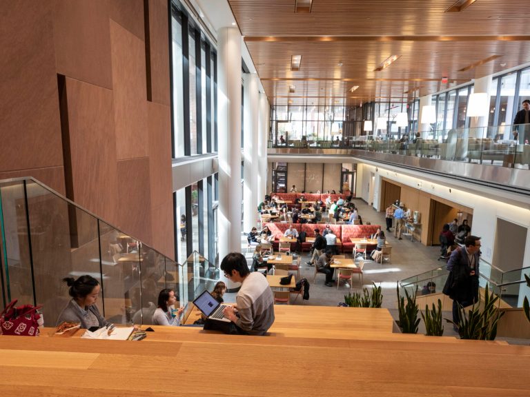 Students working and eating at Harvard Kennedy School
