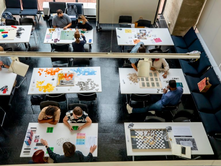 students workin on project at tables