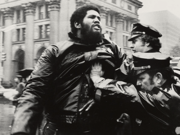 Police pushing an African American man