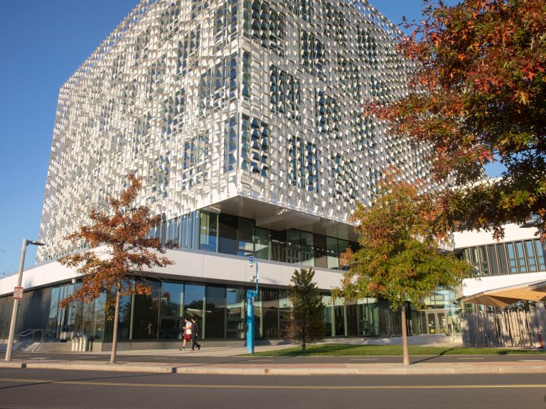 People walking by the Science and Engineering building