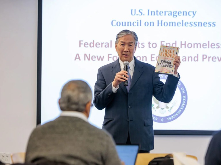 Howard Koh talking to a crowd