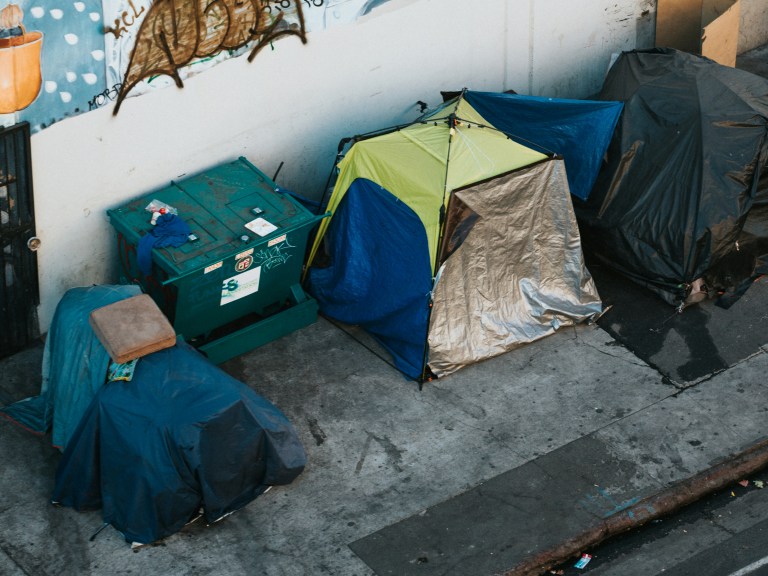 A series of tents on the sidewalk