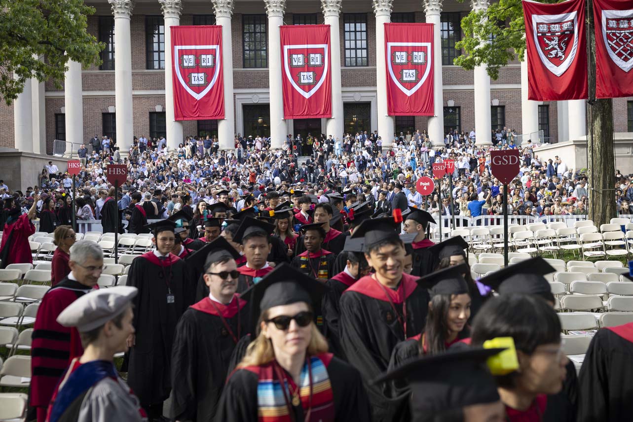 A group of graduating students in Harvard Yard