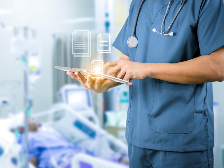 A doctor using a tablet