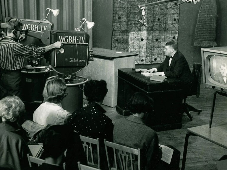 A professor teaching a course on a television set