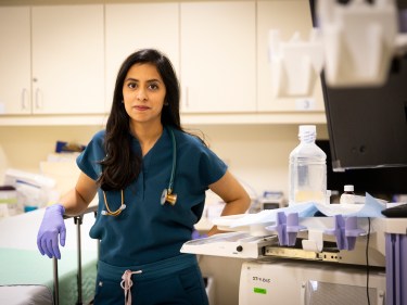 A researcher stands in a surgical room