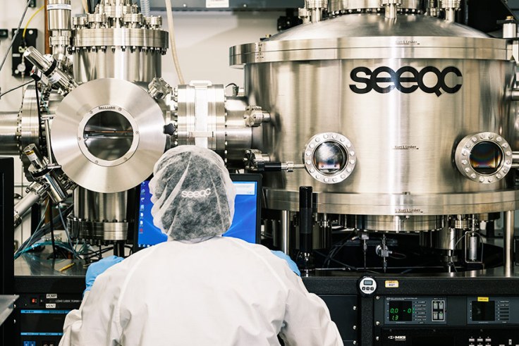 A person in front of a large tubed system