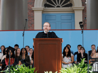 Harvard President Garber at a podium