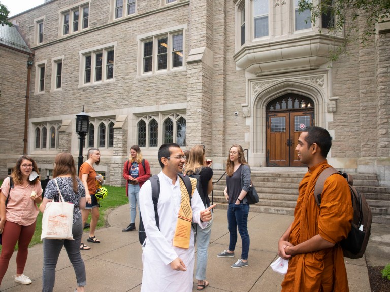Harvard Divinity School students outside of a building