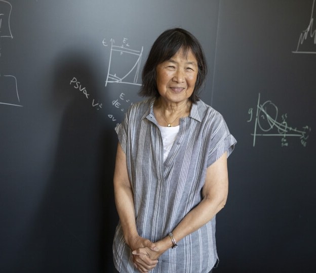Evelyn Hu in front of a blackboard